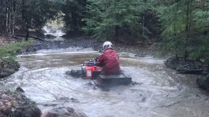 @chriscross4653 leading the #swampdonkeys through the trails in #Muskoka #Honda #water #mud #rain